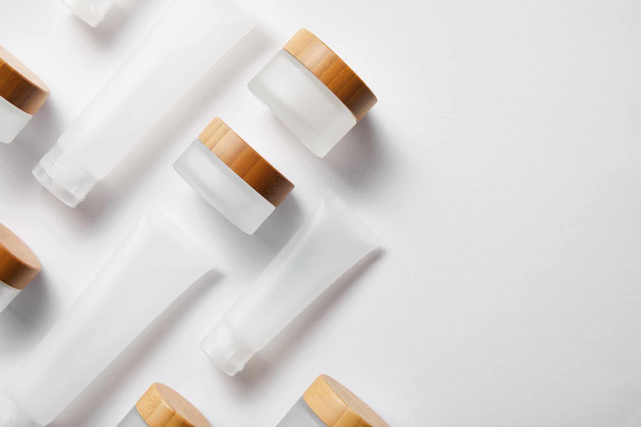Clear glass and bamboo cosmetics packaging
